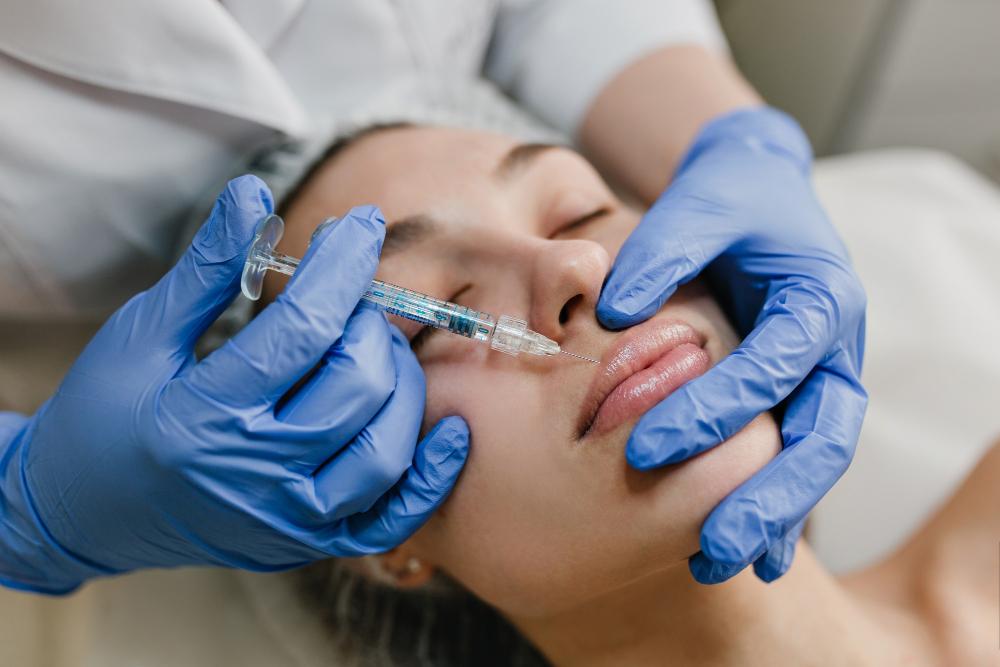 A women receiving filler injections on her lip